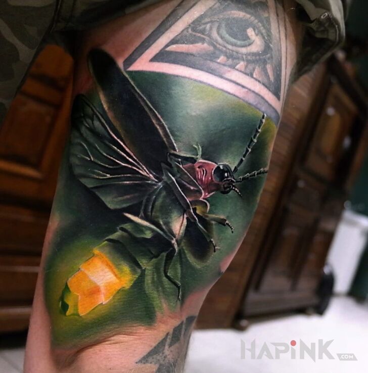 Tattoo Świetlik in butterflies motif and realistic style on the leg