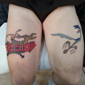 Tattoo Ostrich and Coyote on the thigh motif: characters style: cartoon / comic book