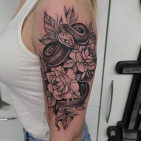 Tattoo Snake flowers On the arm motif: animals style: graphic / illustrative