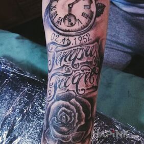 Tattoo Clock with date on the forearm motif: flowers style: realistic
