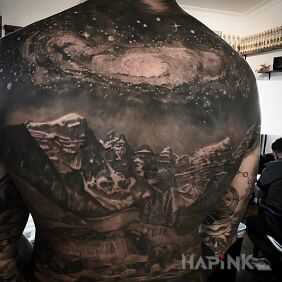 Tattoo Mountains and stars on the shoulder blades motif: cosmos style: realistic