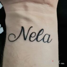 Tattoo Daughter's name on the wrist motif: lettering style: calligraphy