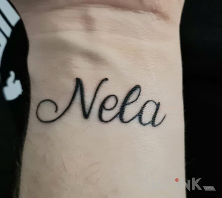 Tattoo Imię córeczki in lettering motif and calligraphy style on the wrist
