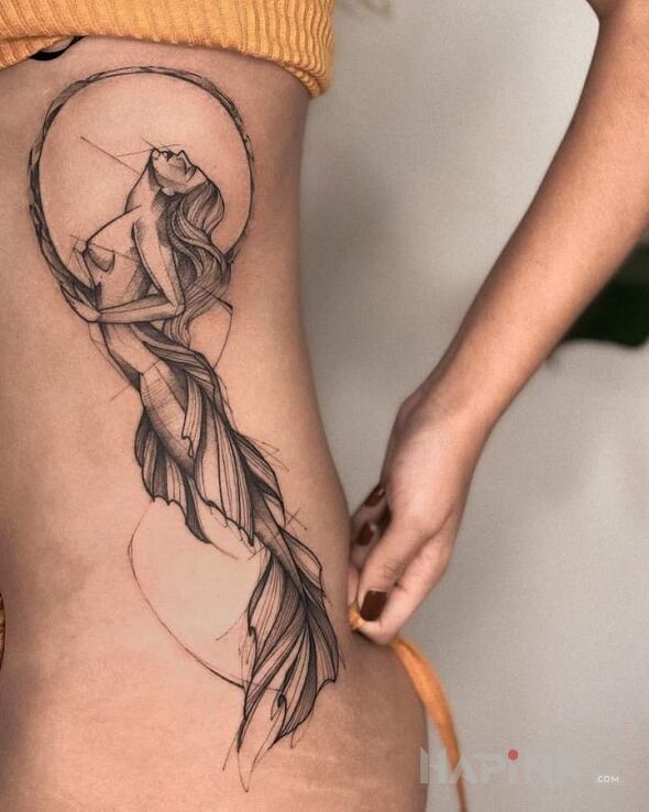 Tattoo Rozmarzona syrena in characters motif and sketch style on the ribs