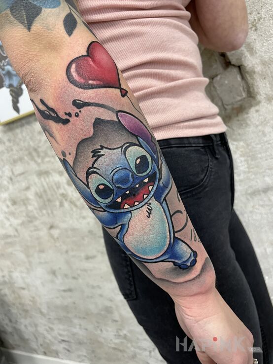 Tattoo Stitch in colorful motif and graphic / illustrative style on the forearm