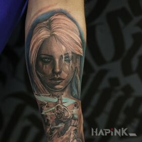 Tattoo Woman on the forearm motif: faces style: realistic
