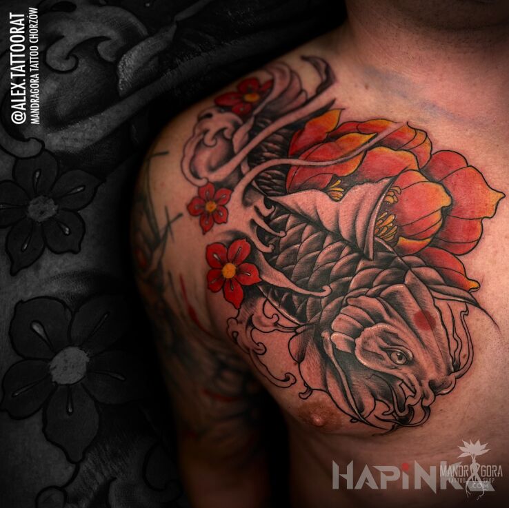 Tattoo Karp Koi in black and gray motif and japanese / irezumi style on the collarbone