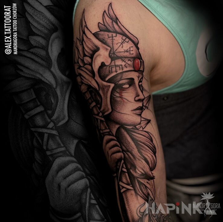 Tattoo Walkiria in black and gray motif and graphic / illustrative style on the upper arm