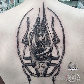 Tattoo Beetle - the animal of power. City on the abdomen. on the back motif: insects style: graphic / illustrative