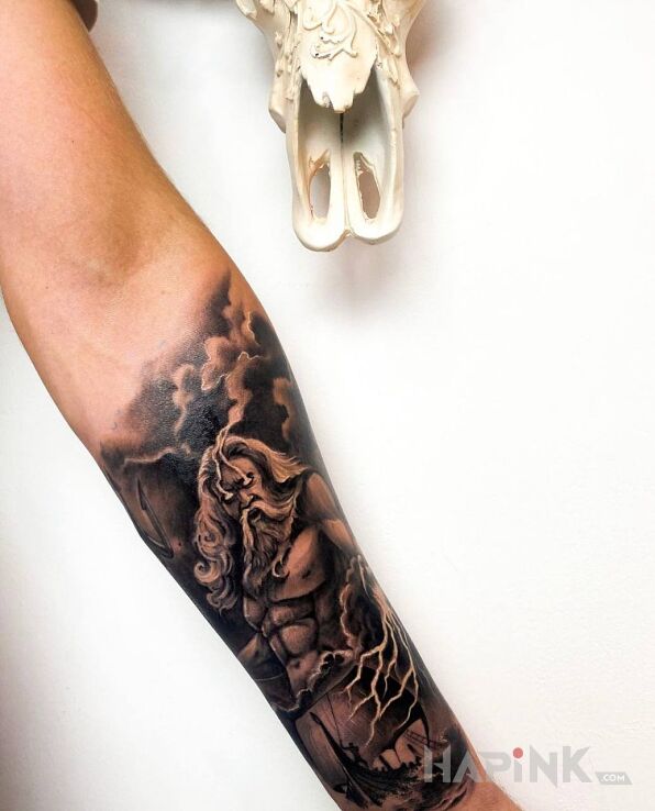 Tattoo Bóg Posejdon in characters motif and realistic style On the arm