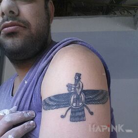 Tattoo Hindu god of wind;) on the upper arm motif: religious