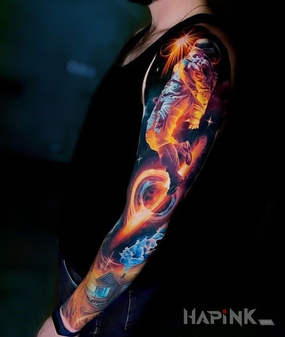 Tattoo W kosmos wzięcie in sleeves motif and realistic style on the forearm