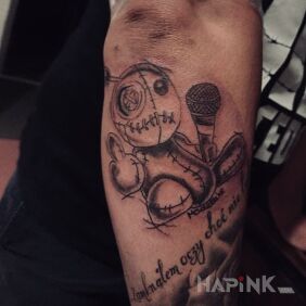 Tattoo GuziK On the arm motif: lettering style: graphic / illustrative