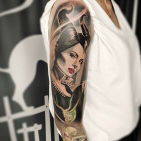 Tattoo Diabolina on the upper arm motif: fantasy style: realistic