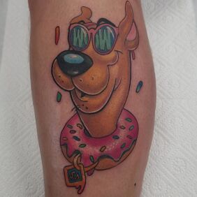 Tattoo ScoobyDoo on the forearm motif: colorful style: newschool