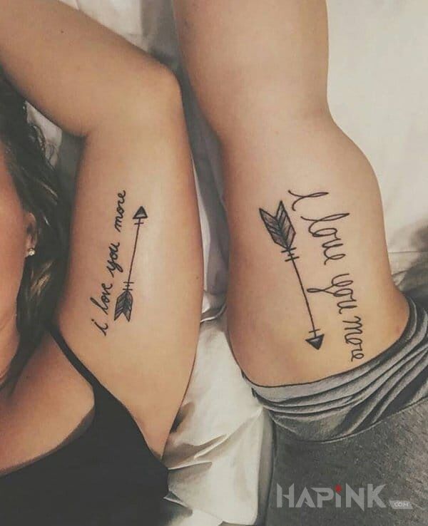 Tattoo I love you more in lettering motif on the upper arm