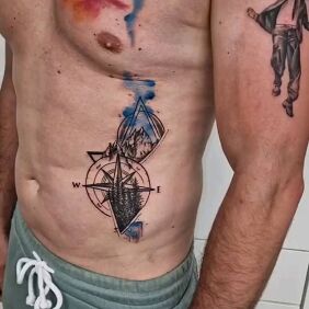 Tattoo Compass rose dotwork on the ribs motif: black and gray style: Watercolor