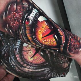 Tattoo Eye of the dragon on the forearm motif: dragons