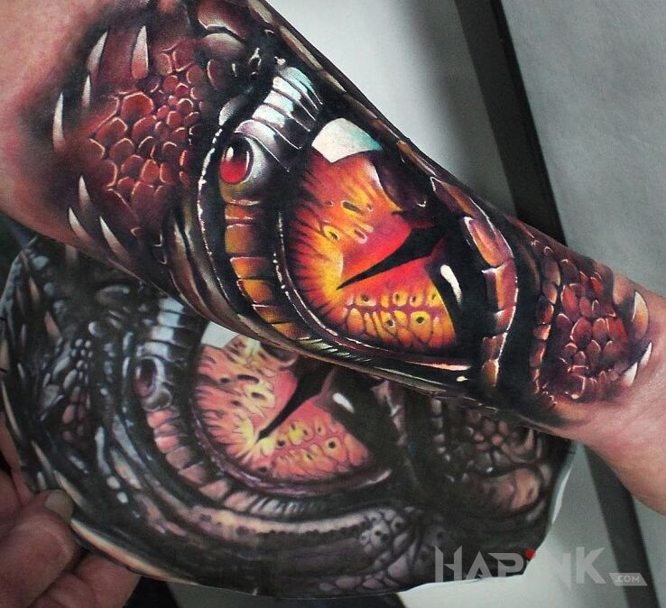 Tattoo Oko smoka in dragons motif on the forearm