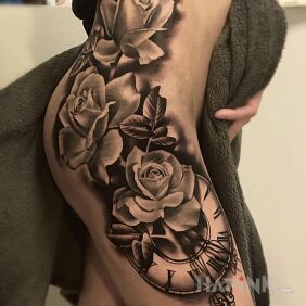 Tattoo Roze and the clock on the leg motif: sexy style: realistic