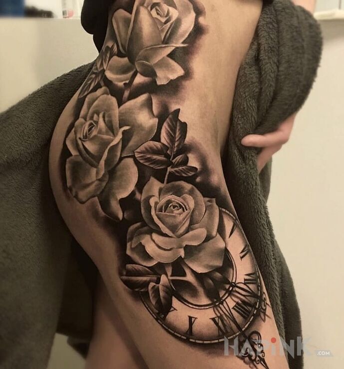 Tattoo Roze i zegar in flowers motif and realistic style on the ribs