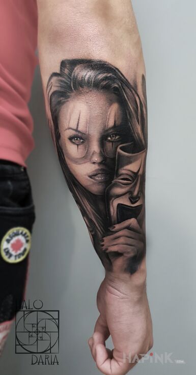 Tattoo PORTRET in black and gray motif and realistic style On the arm