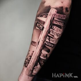 Tattoo SIGNPOST on the forearm motif: lettering style: realistic