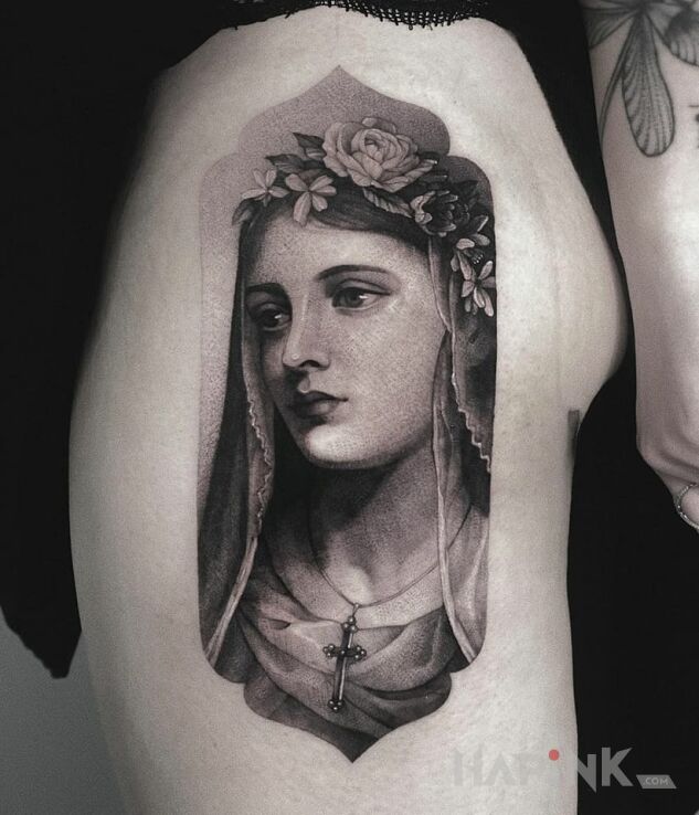 Tattoo MARYJA in religious motif and graphic / illustrative style on the thigh