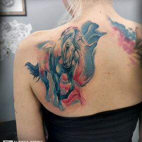 Tattoo Watercolor unicorn on the shoulder blades motif: animals style: Watercolor