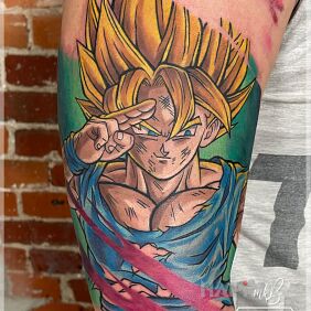 Tattoo Greetings from Song on the upper arm motif: characters style: cartoon / comic book