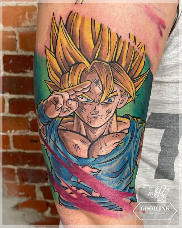 Tattoo Salut od Songa in faces motif and cartoon / comic book style on the upper arm