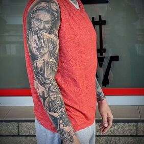 Tattoo Silesian motif On the arm motif: faces style: realistic