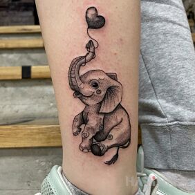 Tattoo Elephant on the leg motif: black and gray style: graphic / illustrative