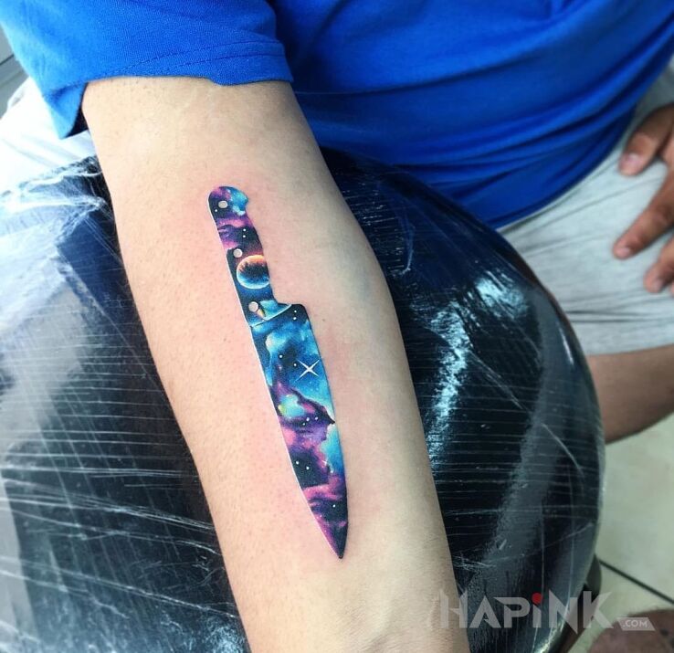 Tattoo Kosmiczny nóż in other motif on the forearm