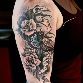 Tattoo Girl with a raven On the arm motif: black and gray style: graphic / illustrative