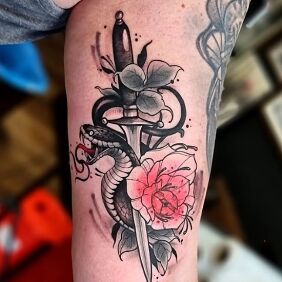 Tattoo Snake and dagger on the forearm motif: colorful style: newschool