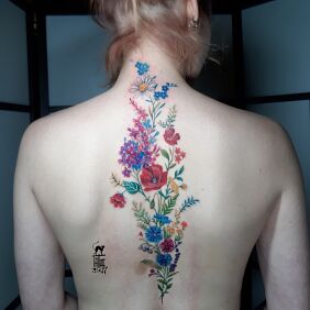 Tattoo Back full of wildflowers on the nape motif: nature style: realistic