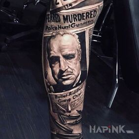Tattoo Vito Corleone in the newspaper on the tibia motif: faces style: realistic