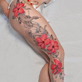Tattoo Snake and red flowers on the calf motif: colorful style: graphic / illustrative