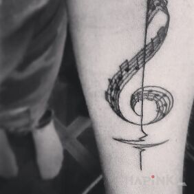 Tattoo Violin key with stave and notes on the forearm motif: other