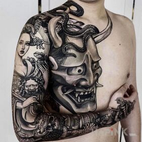 Tattoo Japanese demon On the arm motif: faces style: graphic / illustrative