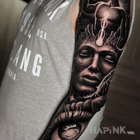 Tattoo Enlightened in space on the upper arm motif: sleeves style: realistic