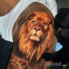 Tattoo Beautiful lion On the arm motif: colorful style: realistic