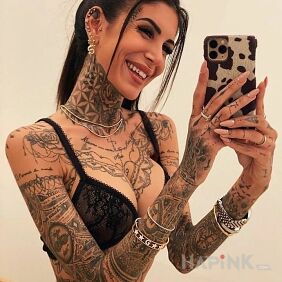 Tattoo Beautiful, smiling and tattooed on the neck motif: flowers style: graphic / illustrative