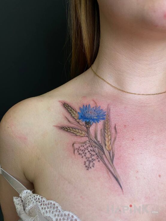 Tattoo Kwiatek patriotyczny ukrainski in colorful motif and realistic style on the collarbone