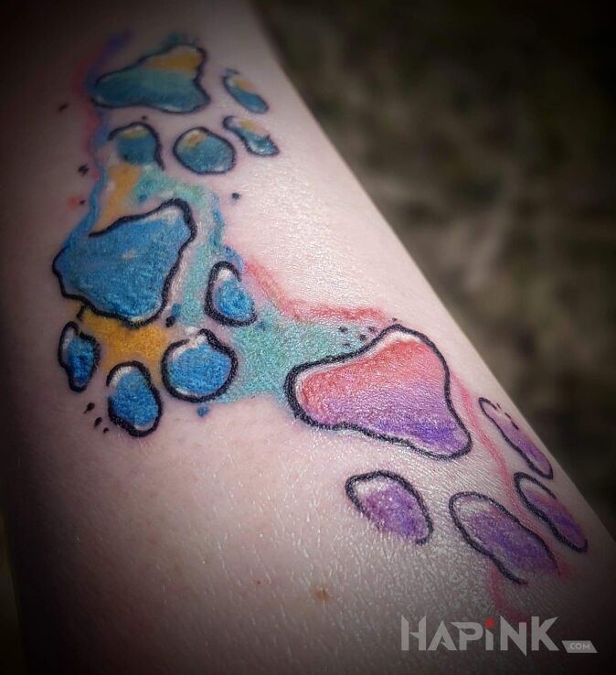 Tattoo Łapki in other motif and Watercolor style On the arm