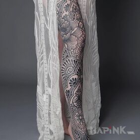 Tattoo Leg full of outlined holes on the thigh motif: flowers style: contour / linework