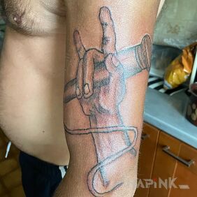 Tattoo Rapper On the arm motif: black and gray style: graphic / illustrative