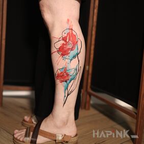 Tattoo Watercolor Poppy on the leg motif: flowers style: Watercolor