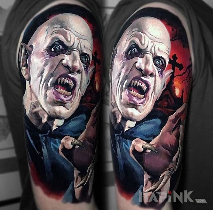 Tattoo Nosferatu in colorful motif on the upper arm